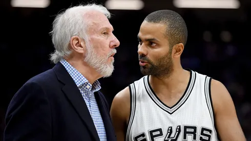 Gregg Popovich of the San Antonio Spurs talks with Tony Parker during an NBA game against the Sacramento Kings on October 27, 2016.