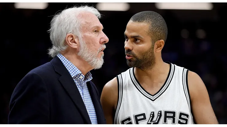 Gregg Popovich of the San Antonio Spurs talks with Tony Parker during an NBA game against the Sacramento Kings on October 27, 2016.