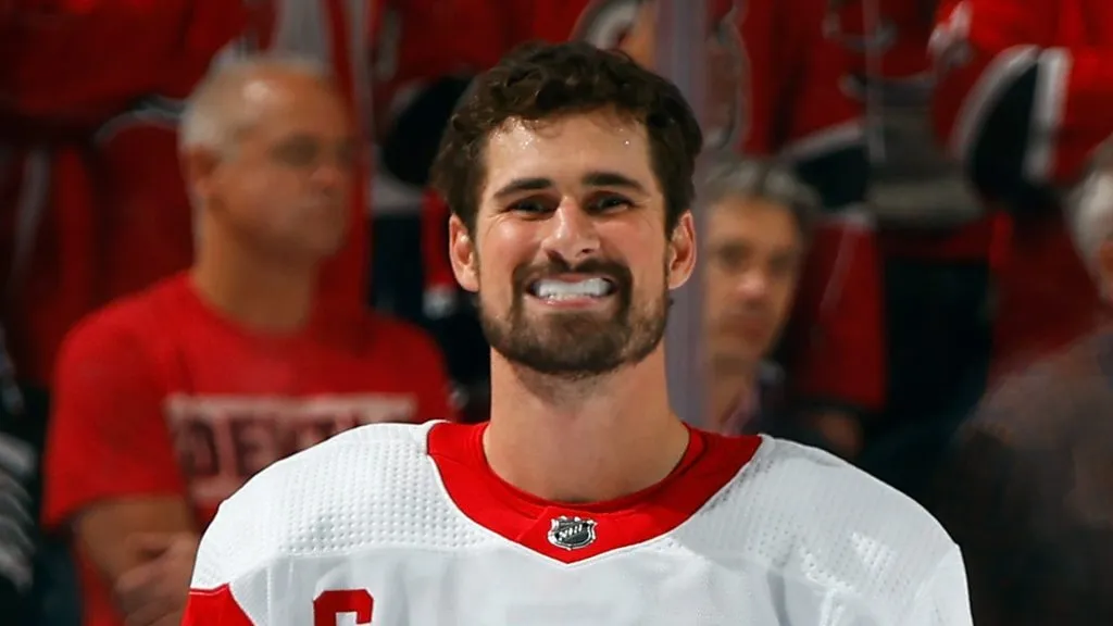 Dylan Larkin #71 of the Detroit Red Wings waits during the national anthem prior to playing against the New Jersey Devils at the Prudential Center on October 12, 2023 in Newark, New Jersey.