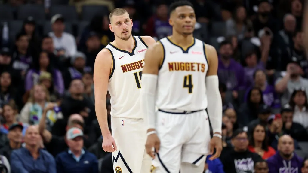 Russell Westbrook #4 and Nikola Jokic #15 of the Denver Nuggets stand on the court during their game against the Sacramento Kings. (Ezra Shaw/Getty Images)