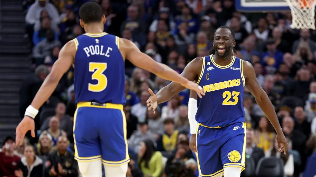 Draymond Green #23 of the Golden State Warriors congratulates Jordan Poole #3 after he made a basket against the San Antonio Spurs at Chase Center. (Ezra Shaw/Getty Images)
