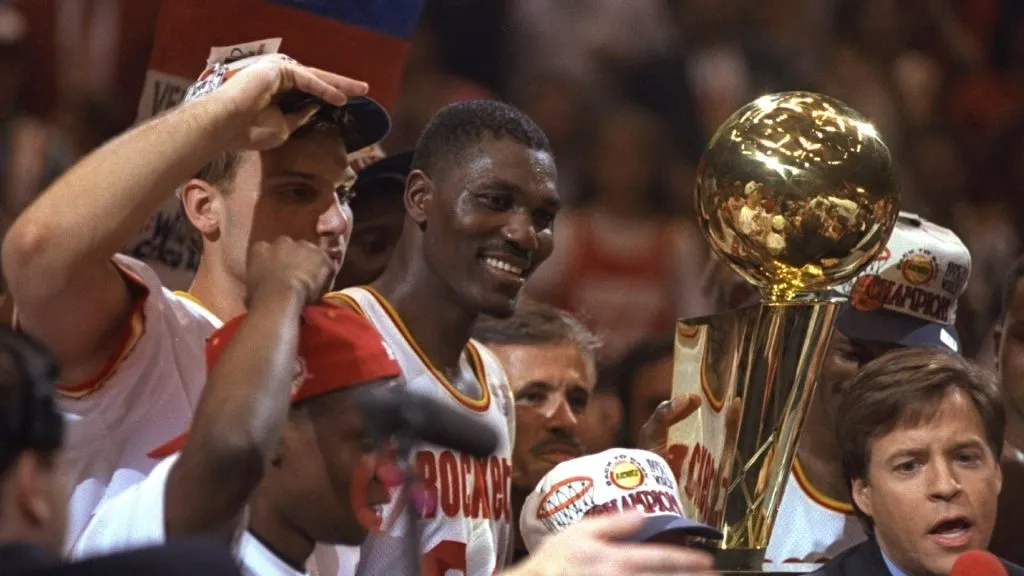 Center Hakeen Olajuwon of the Houston Rockets celebrates after a Finals game against the Orlando Magic. (Allsport / Getty Images)