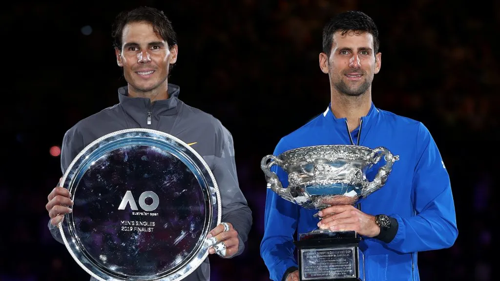 Novak Djokovic poses with the Norman Brookes Challenge Cup following a victory against Rafael Nadal in the 2019 Australian Open final. (Julian Finney/Getty Images)