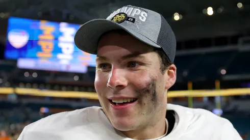 Riley Leonard #13 of the Notre Dame Fighting Irish celebrates after defeating the Penn State Nittany Lions 27-24 in the Capital One Orange Bowl at Hard Rock Stadium on January 09, 2025 in Miami Gardens, Florida.