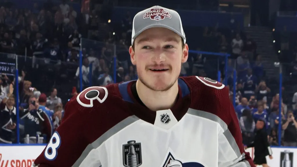 Cale Makar of the Colorado Avalanche carries the Stanley Cup following the series winning victory over the Tampa Bay Lightning in Game Six of the 2022 NHL Stanley Cup Final at Amalie Arena on June 26, 2022 in Tampa, Florida. 
