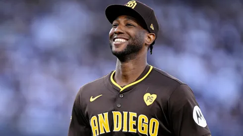 Jurickson Profar #10 of the San Diego Padres walks across the field in the third inning against the Los Angeles Dodgers during Game Two of the Division Series at Dodger Stadium on October 06, 2024 in Los Angeles, California.