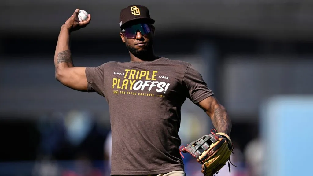 Jurickson Profar #10 of the San Diego Padres warms up before Game Two of the Division Series against the Los Angeles Dodgers at Dodger Stadium on October 06, 2024 in Los Angeles, California. (Photo by Orlando Ramirez/Getty Images)