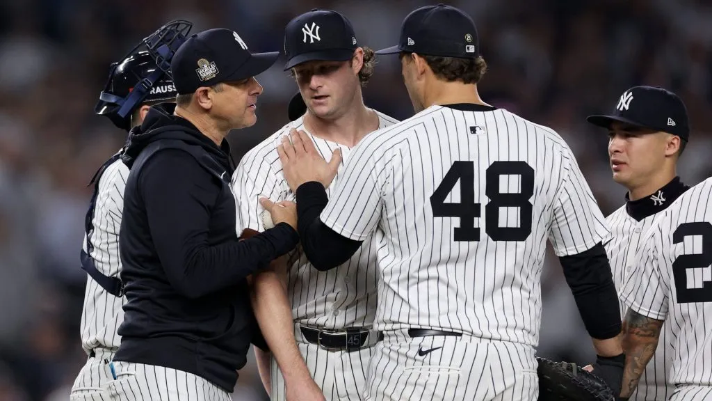 Manager Aaron Boone #17 of the New York Yankees relieves starting pitcher Gerrit Cole #45 during the seventh inning of Game Five of the 2024 World Series against the Los Angeles Dodgers at Yankee Stadium on October 30, 2024 in the Bronx borough of New York City. (Photo by Elsa/Getty Images)