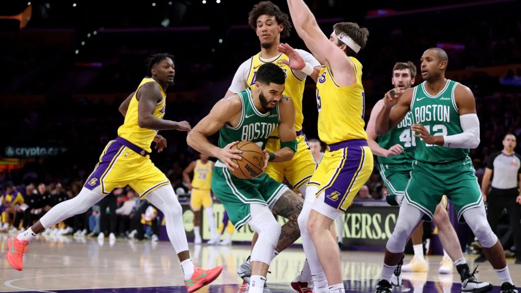 Jayson Tatum #0 of the Boston Celtics drives to the basket on Austin Reaves #15 and Jaxson Hayes #11of the Los Angeles Lakers during a 117-96 Lakers win at Crypto.com Arena. (Harry How/Getty Images)