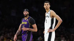 Victor Wembanyama #1 of the San Antonio Spurs stands next to Anthony Davis #3 of the Los Angeles Lakers during the second half of a game at Crypto.com Arena.