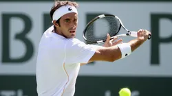 Potito Starace of Italy returns a shot to Donald Young of the USA during the BNP Paribas Open at the Indian Wells Tennis Garden