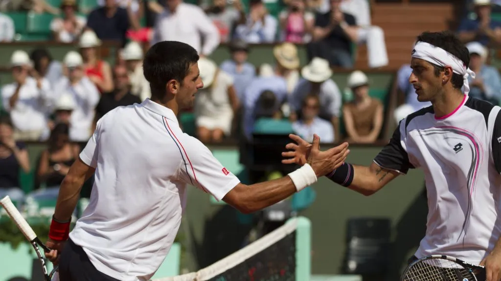 Novak Djokovic shakes hands with Potito Starace following their match on day 2 of the 2012 Roland Garros. (IMAGO / Action Plus)