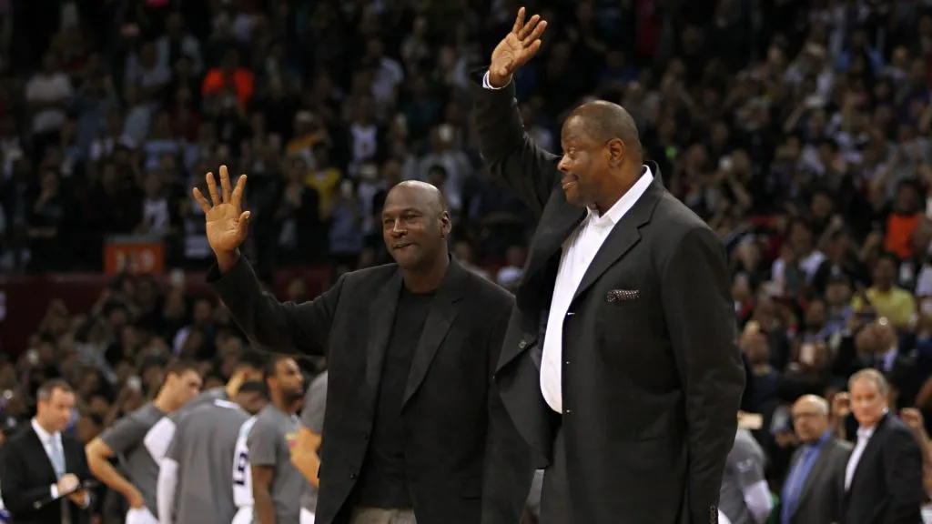 Michael Jordan and Patrick Ewing wave to fans during the match between Charlotte Hornets and Los Angeles Clippers on October 11, 2015 in Shenzhen, China.