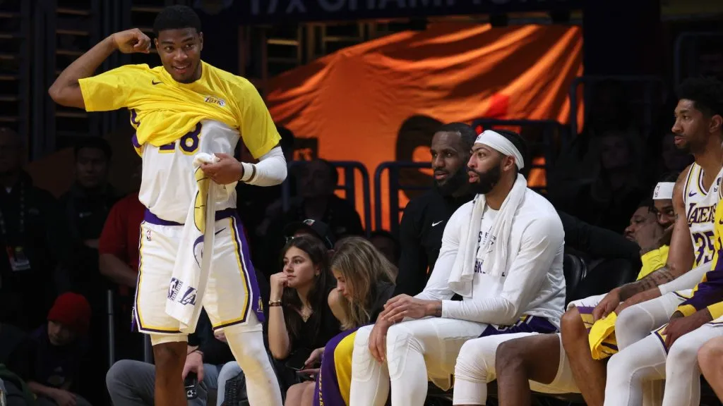 Rui Hachimura #28 of the Los Angeles Lakers react to play from the bench with LeBron James #23 and Anthony Davis #3 during a 134-110 win over the Portland Trail Blazers at Crypto.com Arena on January 21, 2024 in Los Angeles, California. (Photo by Harry How/Getty Images)