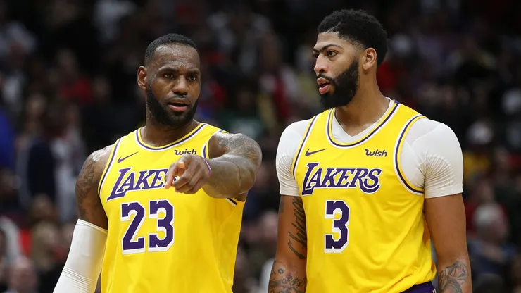 Anthony Davis #3 of the Los Angeles Lakers and LeBron James #23 of the Los Angeles Lakers talk during the game against the New Orleans Pelicans.
