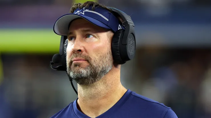 Dallas Cowboys head coach Brian Schottenheimer during his time as offensive coordinator watches from the sidelines in a preseason game against the Las Vegas Raiders at AT&T Stadium on August 26, 2023 in Arlington, Texas.