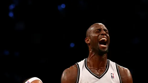 Kevin Garnett #2 of the Brooklyn Nets celebrates after he got the loose ball with teammate Paul Pierce #34 in the second quarter against the Toronto Raptors