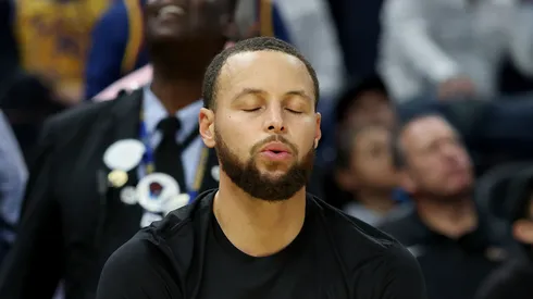 Stephen Curry #30 of the Golden State Warriors, wearing a shirt honoring Martin Luther King Jr