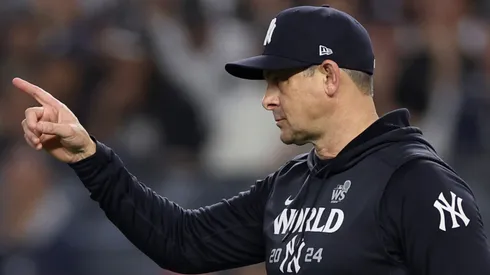 Manager Aaron Boone #17 of the New York Yankees motions to the bullpen during the eighth inning of Game Five of the 2024 World Series against the Los Angeles Dodgers at Yankee Stadium on October 30, 2024 in the Bronx borough of New York City.