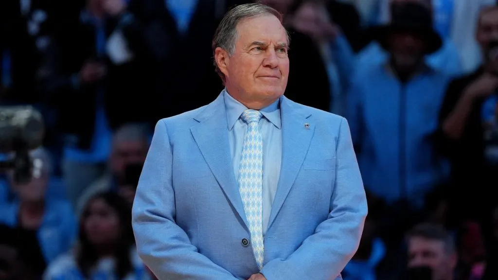 Head coach Bill Belichick of the North Carolina Tar Heels addresses the crowd during halftime in the game against the La Salle Explorers. (Source: Grant Halverson/Getty Images)