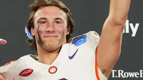 Dabo Swinney, Cade Klubnik #2 and the Clemson Tigers celebrate after winning the 2024 ACC Football Championship at Bank of America Stadium on December 07, 2024 in Charlotte, North Carolina.