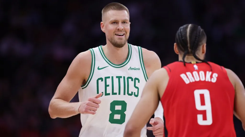 Kristaps Porzingis #8 of the Boston Celtics reacts against Dillon Brooks #9 of the Houston Rockets during the first half at Toyota Center. (Alex Slitz/Getty Images)