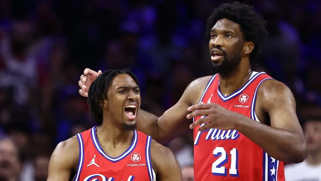 Tyrese Maxey #0 and Joel Embiid #21 of the Philadelphia 76ers during a game against the New York Knicks on April 28, 2024 in Philadelphia, Pennsylvania.