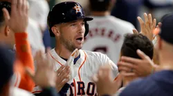 Alex Bregman #2 of the Houston Astros is congratulated in the dugout by teammates after hitting a solo home run in the first inning against the Seattle Mariners at Minute Maid Park on September 24, 2024 in Houston, Texas.