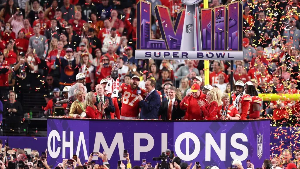 Travis Kelce #87 of the Kansas City Chiefs holds the Lombardi Trophy after defeating the San Francisco 49ers 25-22 in overtime during Super Bowl LVIII in 2024. (Source: Steph Chambers/Getty Images)