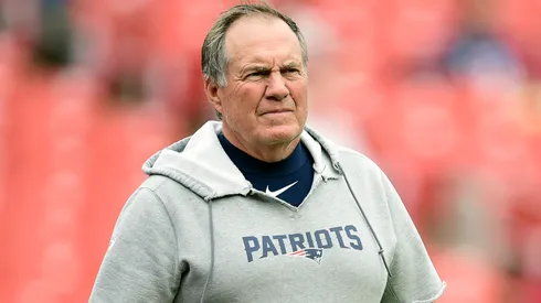 Former New England Patriots head coach Bill Belichick looks on during an NFL game.