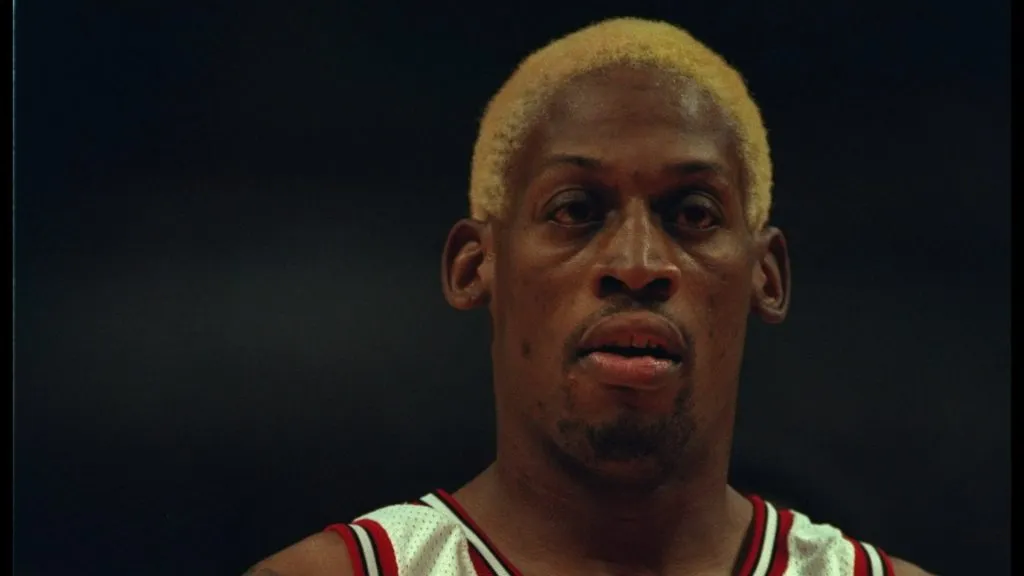Dennis Rodman #91 of the Chicago Bulls stands on the court at the United Center in Chicago.