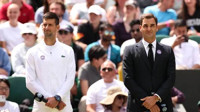 Djokovic andFederer look on during the Centre Court Centenary Celebration in 2022 (Ryan Pierse/Getty Images)