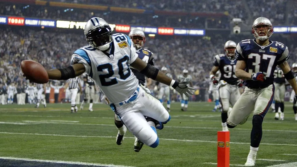 Running back DeShaun Foster #20 of the Carolina Panthers scores on a 33 yard touchdown run against the New England Patriots during Super Bowl XXXVIII in 2004. (Source: Brian Bahr/Getty Images)