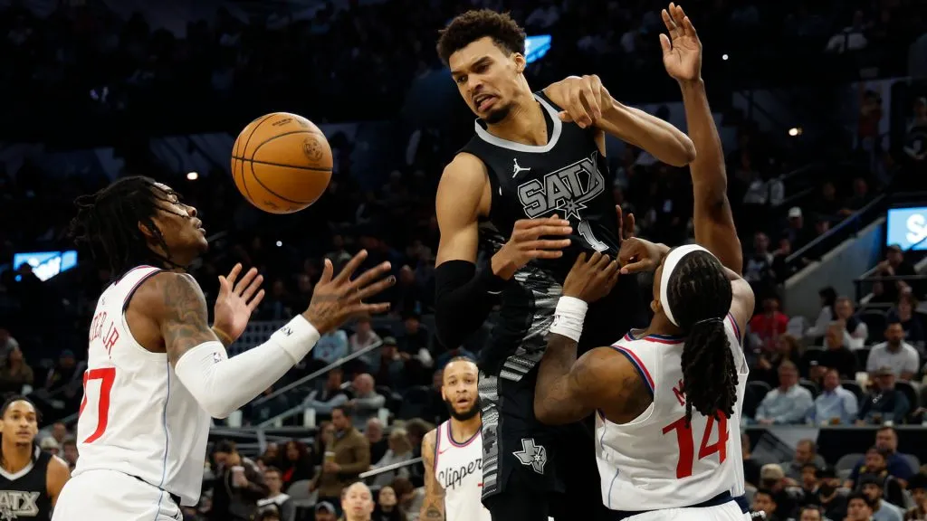 Victor Wembanyama #1 of the San Antonio Spurs is fouled by Terance Mann #14 of the Los Angeles Clippers in the first half at Frost Bank Center. (Ronald Cortes/Getty Images)