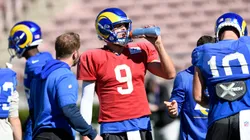 Quarterback Matthew Stafford #9 of the Los Angeles Rams takes a water break as head coach Sean McVay looks on during practice in preparation for Super Bowl LVI in 2022.