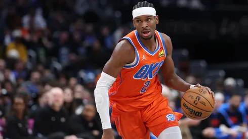 Shai Gilgeous-Alexander #2 of the Oklahoma City Thunder dribbles the ball up the court against the Washington Wizards.