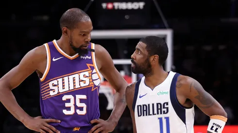 Kevin Durant #35 of the Phoenix Suns talks with Kyrie Irving #11 of the Dallas Mavericks during the second half