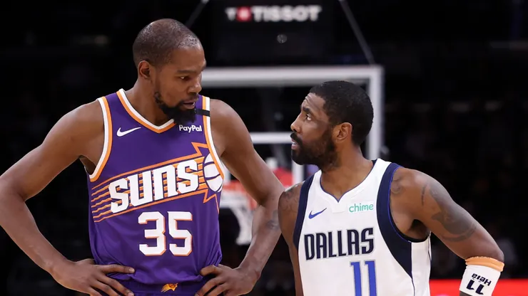 Kevin Durant #35 of the Phoenix Suns talks with Kyrie Irving #11 of the Dallas Mavericks during the second half