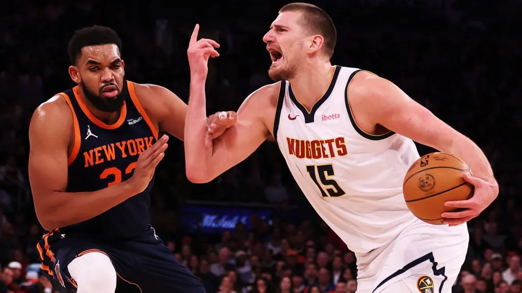 Nikola Jokic #15 of the Denver Nuggets is fouled by Karl-Anthony Towns #32 of the New York Knicks during their game at Madison Square Garden. (Al Bello/Getty Images)