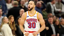 Stephen Curry #30 of the Golden State Warriors celebrates his three-point basket against the Minnesota Timberwolves in the fourth quarter at Target Center.