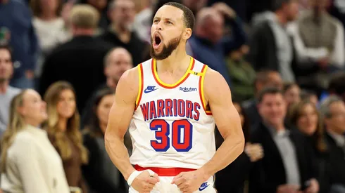 Stephen Curry #30 of the Golden State Warriors celebrates his three-point basket against the Minnesota Timberwolves in the fourth quarter at Target Center.