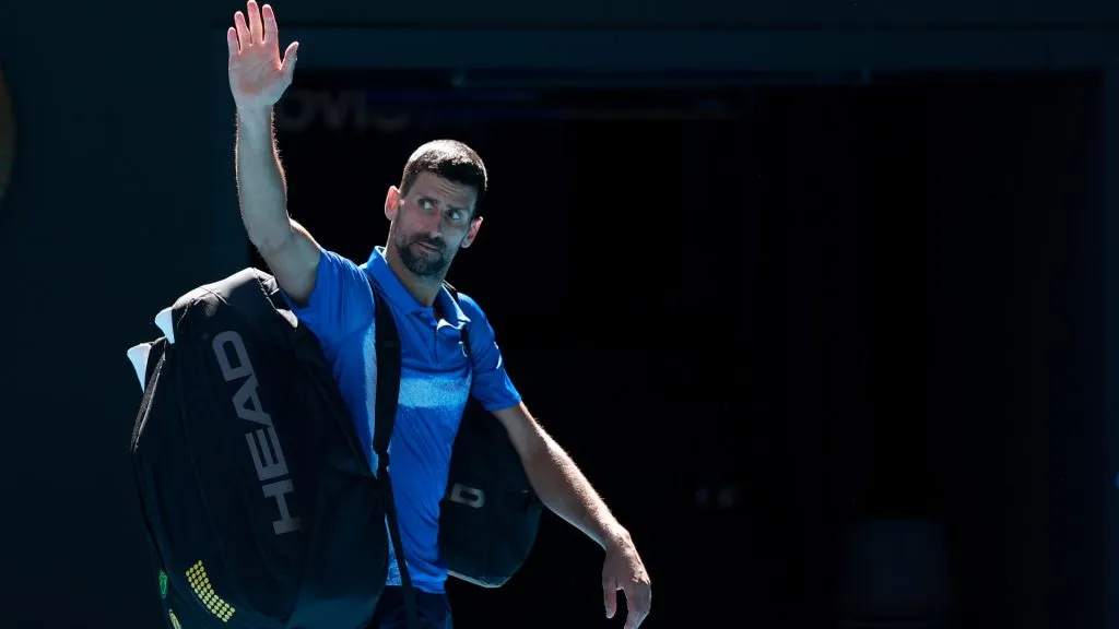 Novak Djokovic of Serbia acknowledges the crowd as he leaves the court after retiring from the Australian Open. (Darrian Traynor/Getty Images)