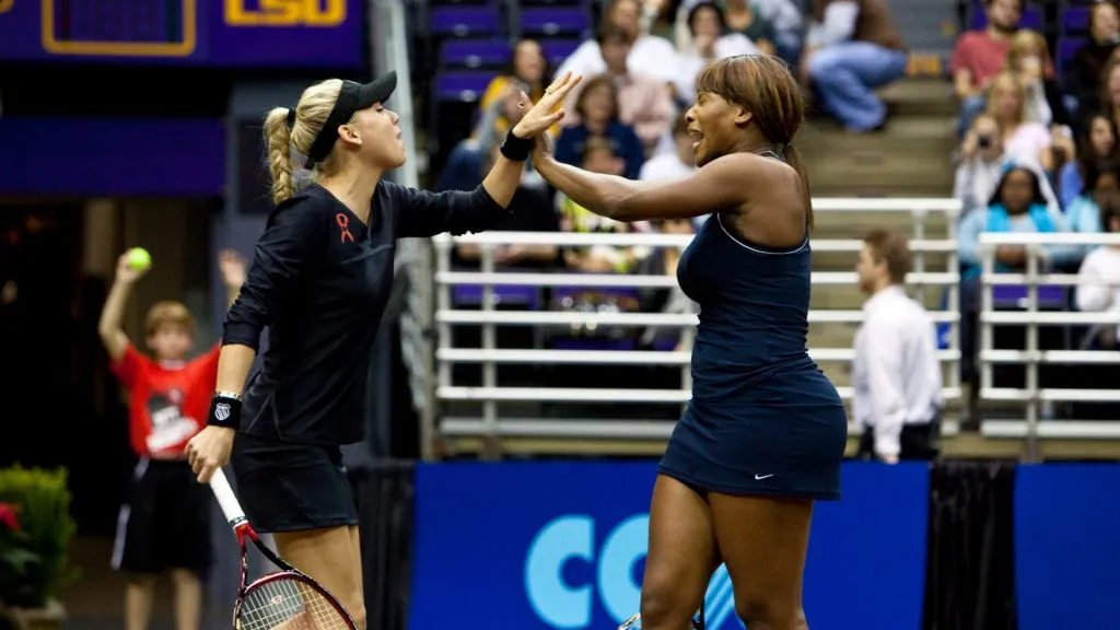 Anna Kournikova high-fives teammate Serena Williams during the 17th Annual World Team Tennis Smash Hits (Skip Bolen/Getty Images)