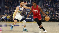 Jimmy Butler #22 of the Miami Heat is guarded by Stephen Curry #30 of the Golden State Warriors at Chase Center on October 27, 2022 in San Francisco, California.