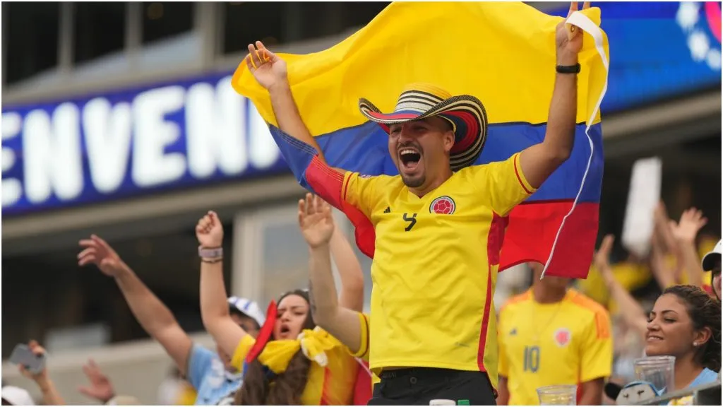 A fan of Colombia waves a flag – Grant Halverson/Getty Images
