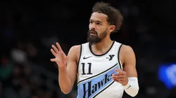 Trae Young #11 of the Atlanta Hawks reacts after drawing a foul on a three-point basket against the Houston Rockets.