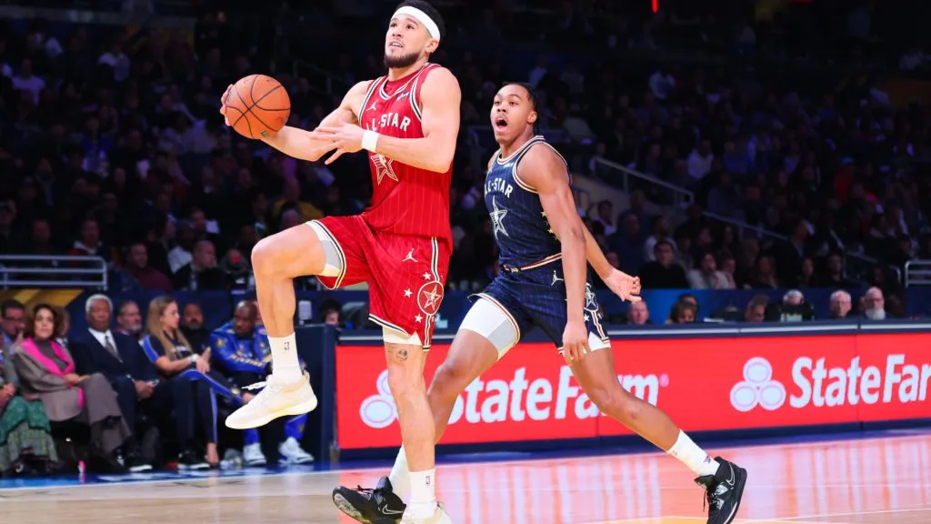 Devin Booker drives to the basket during the 2024 NBA All-Star Game. (Stacy Revere/Getty Images)