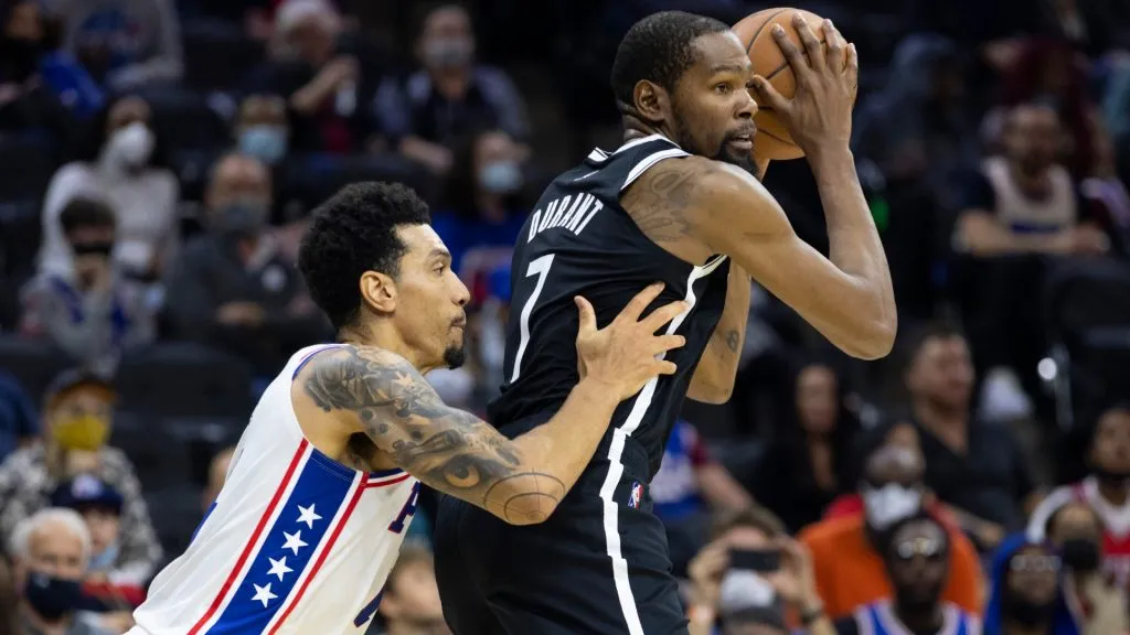 Kevin Durant controls the ball against Danny Green during a game between the Brooklyn Nets and the Philadelphia 76ers on October 11, 2021.
