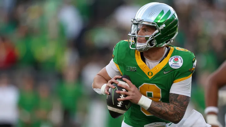 Dillon Gabriel #8 of the Oregon Ducks scrambles with the ball during the Rose Bowl game against the Ohio State Buckeyes at Rose Bowl Stadium on January 01, 2025 in Pasadena, California.
