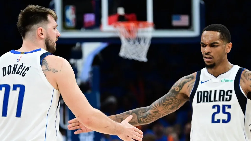 P.J. Washington #25 and Luka Doncic #77 of the Dallas Mavericks high five 